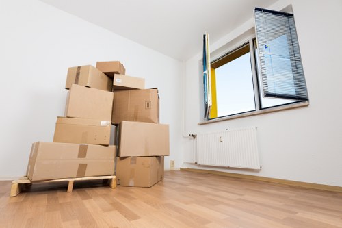 Professional movers loading items for a flat move near Stockwell Underground