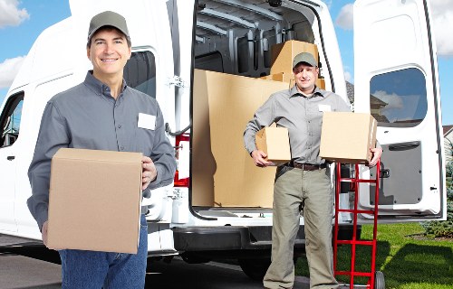 Packed boxes and protected furniture prepared for moving day