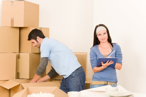 Loading household furniture into a removal truck in South London